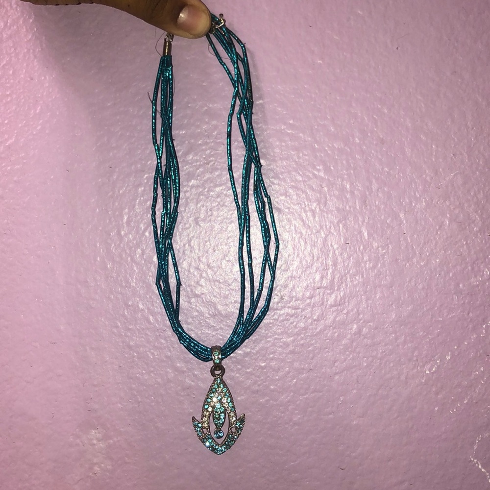 Blue diamond encrusted necklace